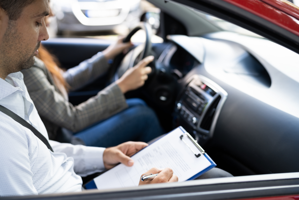 Learner driver practicing observation and mirror checks during a driving lesson